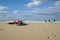 Kiteboarding parachute on the beach against the background of the cloudy blue sky. Crete, Greece.