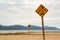 Kiteboarding, wooden kite surfing sign on beach