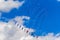 Kites against a blue sky and clouds background