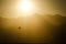 Kites of kiteboarding in Bay during sunset above mountains in Dahab, Sinai, Egypt