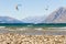 Kitesurfer in front of mountain scenery at lake hawea in New Zealand south island