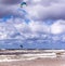 Kitesurfer jumping high in the air