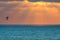 Kitesurfer on Mediterranean sea at sunset in Israel.