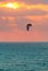 Kitesurfer on Mediterranean sea at sunset in Israel.