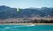 Kitesurfer rides in the Red Sea on the background of a rocky coast in Egypt Dahab South Sinai