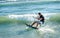 Kitesurfer riding on Kiteboard on the beach in Ulcinj, Montenegr