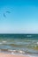 Kitesurfer swimming on an ocean or sea near beach