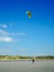 Kitesurfer walking back to the beach at Pointe aux oies, France