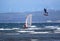 Kitesurfer and windsurfer riding