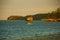 Kitesurfing. Evening landscape of a small island and the sea. Boracay, Philippines.