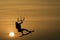 Kitesurfing girl silhouette jumping at golden hour sunset woman kiteboarding jump