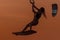 Kitesurfing girl silhouette jumping at golden hour sunset woman kiteboarding jump