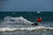 Kitesurfing on the waves of the sea in Mui Ne beach, Phan Thiet, Binh Thuan, Vietnam.