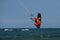 Kitesurfing on the waves of the sea in Mui Ne beach, Phan Thiet, Binh Thuan, Vietnam.