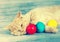 Kitten sleeping with colored eggs