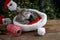 Kitten sleeps in santa claus hat. Christmas pet sleeping. Presents concept. Portrait of kitten. Adorable tabby animal
