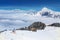 KITZBUEHEL, AUSTRIA - February 18, 2016 - Skier skiing and enjoying the view to Alpine mountains in Austria
