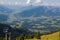 Kitzbuheler Hornbahn cable car with view of valley, mountains, S
