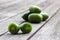 Kiwi berries (arctic kiwifruit) on wooden table