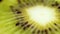 A kiwi close up on a black background. Juicy green a kiwi on a black background. Fruit close up. the kiwi lies on a