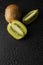 Kiwi fruit isolated on black background with water drops, fresh kiwi fruit. Summer vitamine fruit. Healthy food or dessert. Diet,