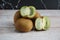 Kiwi fruit on top wooden table. Kiwis are a nutrient-dense food