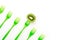 Kiwi and green forks in row on white background with copy spase