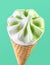 Kiwi ice cream in waffle cone close-up isolated on aquamarine background