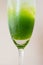 Kiwi juice in clear glass Vertical half-glass