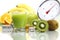 Kiwi juice in glass, fruit meter scales diet food