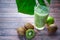 Kiwi smoothies in glass cups on a  table