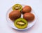 Kiwifruit kiwi kiwis fruit or Chinese gooseberry kiwifruita berries vine fruits actinidia-deliciosa or mihoutao in a plate photo