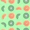 Kiwis and oranges fruits vector seamless pattern