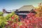 Kiyomizu-dera Temple, famous Buddhist temple in Kyoto, Japan, with red foliage in foreground