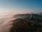 KKiev Ukraine The Motherland Monument USSR heritage. City hills on fog. Beautiful autumn morning. Aerial drone photo.