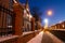 Klaipeda, Lithuania - 01 15 21: Old historical Neo-Gothic University building campus in winter snow, pink sunset colors