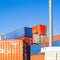 Klaipeda, Lithuania - 02 06 21: colored cargo export container in the warehouse of Klaipeda port docks. Sunny colorful