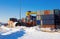 Klaipeda, Lithuania - 02 06 21: colored cargo export container in the warehouse of Klaipeda port docks, yellow crane and