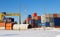 Klaipeda, Lithuania - 02 06 21: colored cargo export container in the warehouse of Klaipeda port docks, yellow crane and