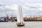 Klaipeda, Lithuania - August 10, 2016: Single sail boat on the baltic sea. Klaipeda. People faces unrecognizable.