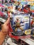 Klang, Malaysia - 20 September 2020 : Hand hold a packed of SABAN'S Power Rangers Gold Ranger for sell in the supermarket