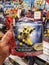 Klang, Malaysia - 20 September 2020 : Hand hold a packed of SABAN\'S Power Rangers Yellow Ranger for sell in the supermarket