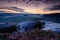 Kleiner Winterberg, beautiful morning view over sandstone cliff into deep misty valley in Saxony Switzerland. Sandstone peaks