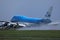 KLM Boeing B747 plane landing on Amsterdam Schiphol Airport AMS