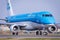 KLM Embraer 170 regional jet lining up runway for departure