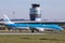KLM Embraer 190 in front of air traffic control tower at airport Graz