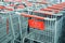 Kmart shopping carts lined up in a cart corral - carts are empty