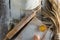 Kneaded dough, ears of wheat,rolling pin, eggs and a bottle of oil on the old rustic table