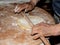 Kneading the sweet pizza manually is Italian peasant tradition with ancient and healthy method