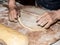 Kneading the sweet pizza manually is Italian peasant tradition with ancient and healthy method, with the hands of an old lady